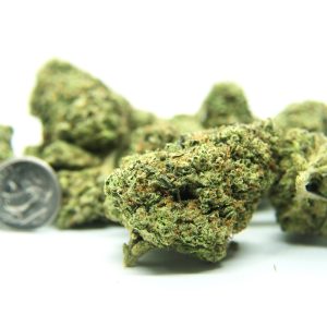 "Group shot of Black Runtz cannabis strain with multiple dense, frosty buds and a coin for size comparison."